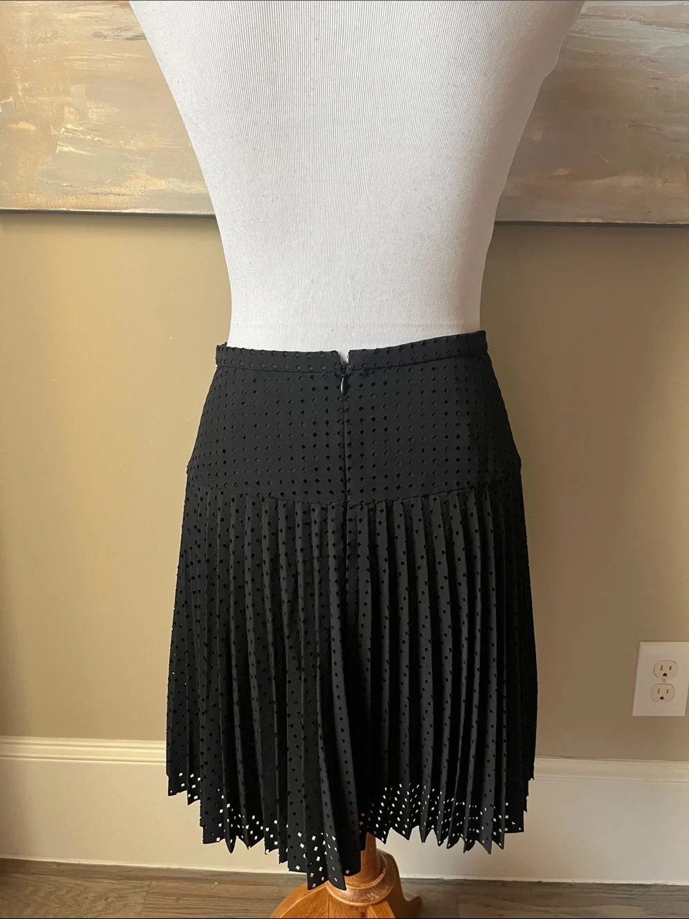 J. Crew black laser cut pleated A-line skirt.